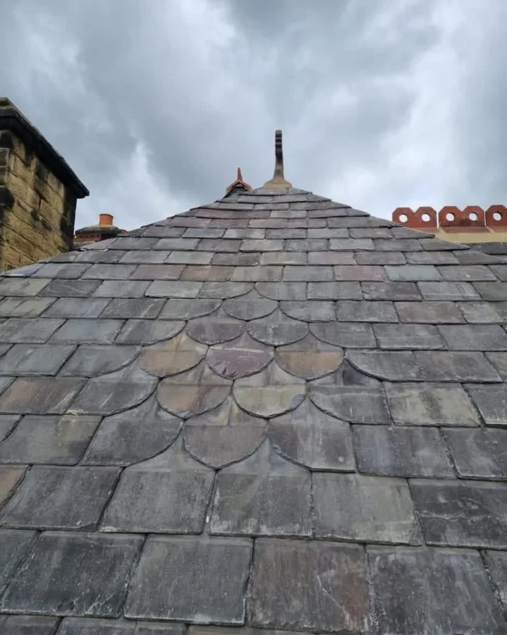 Slate roof slopes meeting at a hip