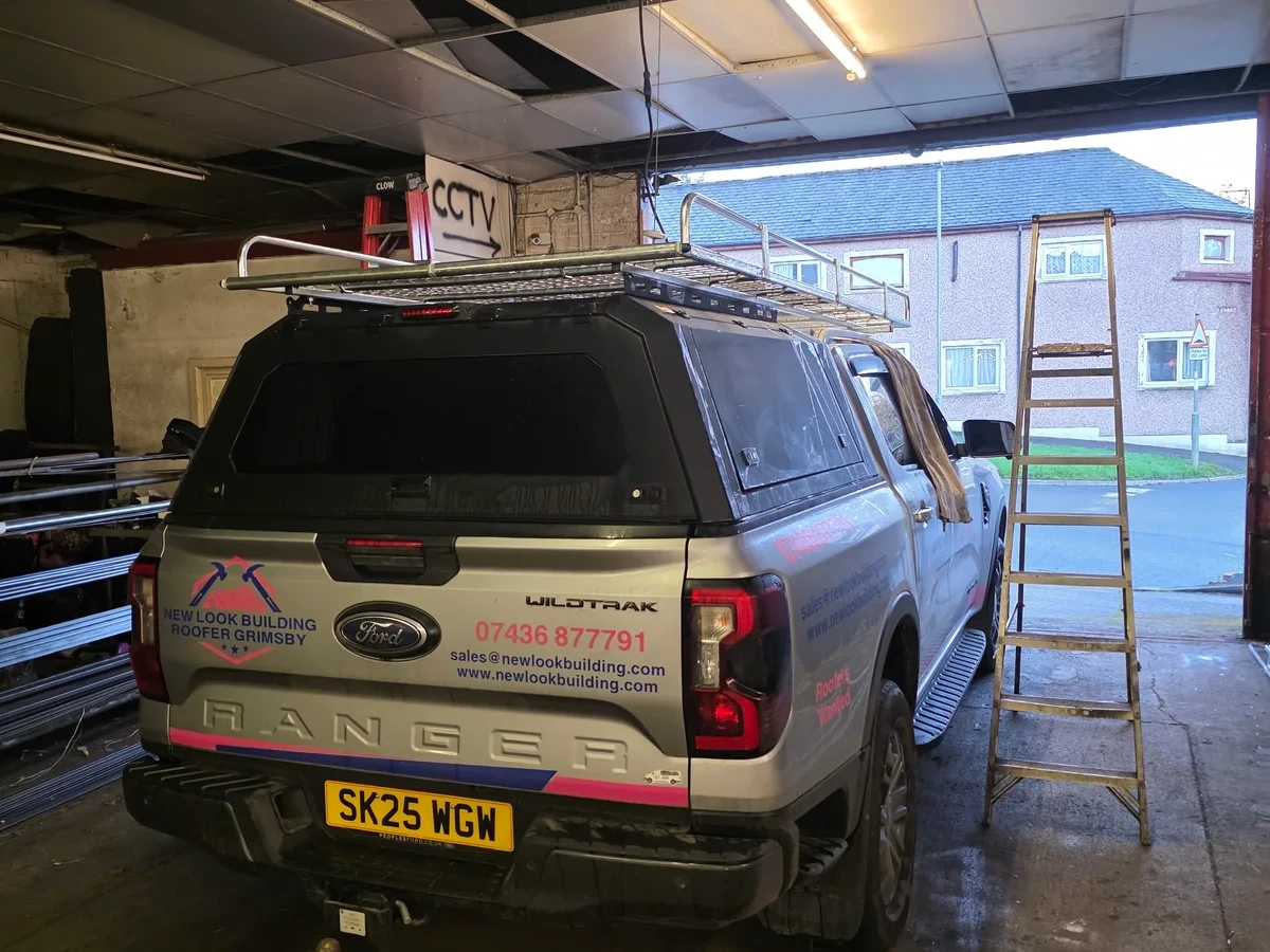 Rear view of the New Look work vehicle inside a workshop