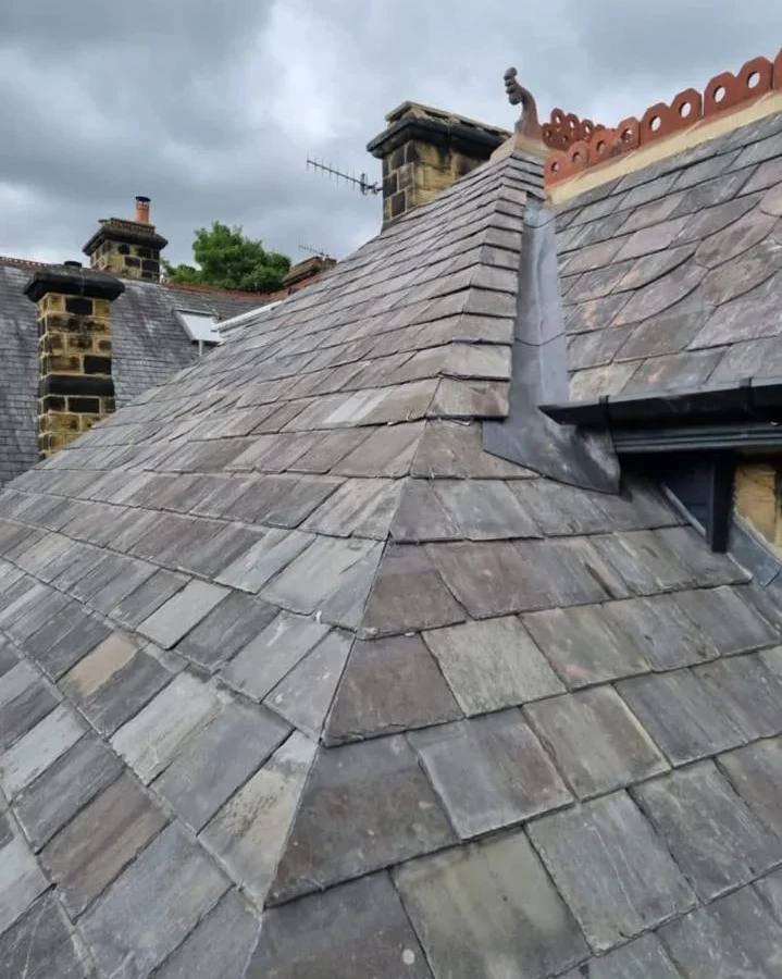 Slate roof junction below a dormer