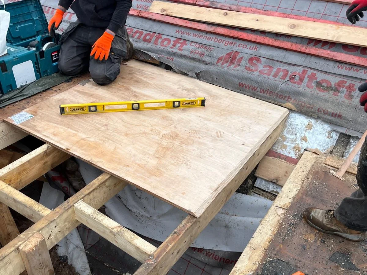 Roof decking being fitted beside battens and membrane