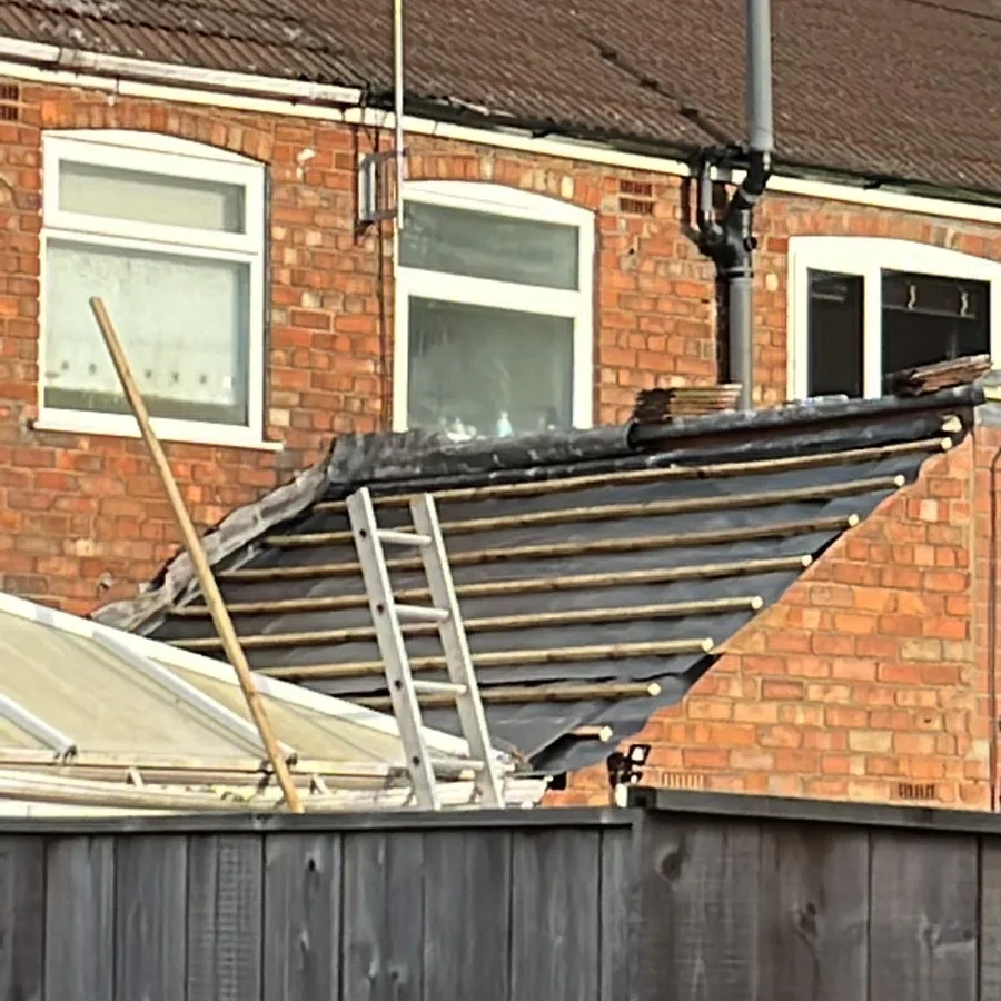 Pitched roof over a brick extension viewed from the garden