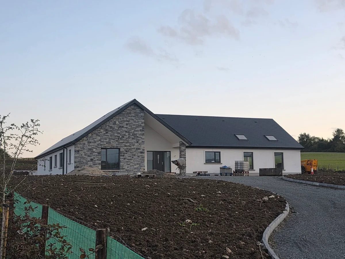 Ground preparation and edging beside a curved driveway