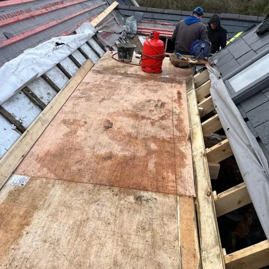 Timber decking and tools in the central roof work area