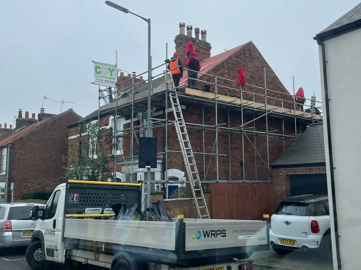 Scaffolded house during roof renewal