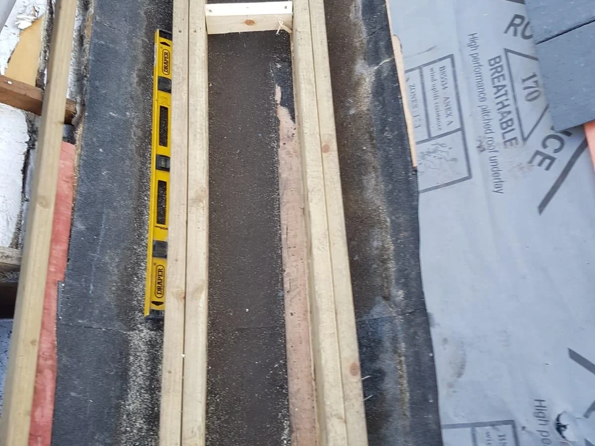 Timber framing and membrane exposed during roof work
