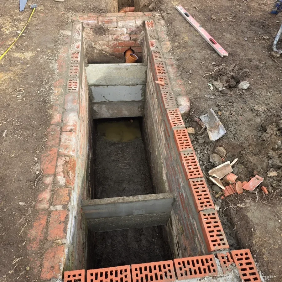 Brickwork surrounding a rectangular excavation