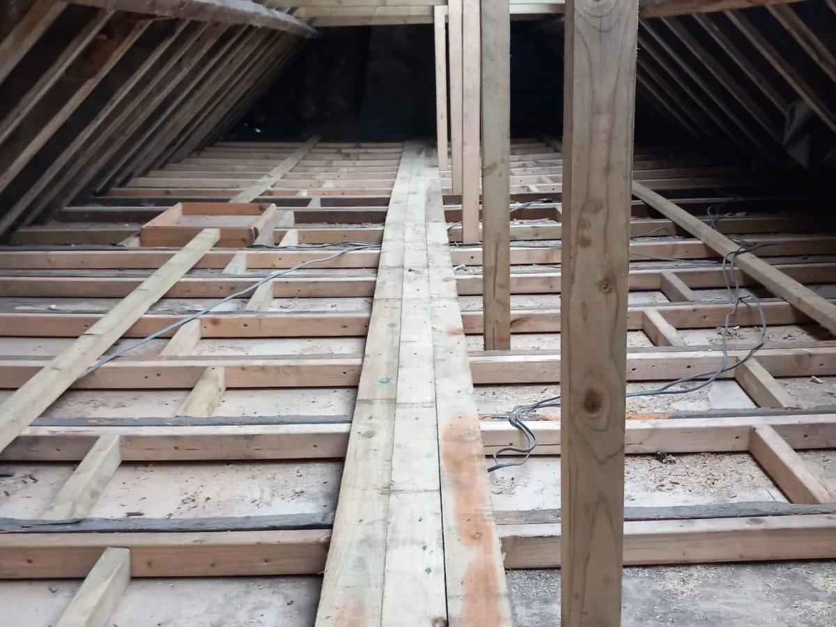 Roof space with exposed joists and support timbers