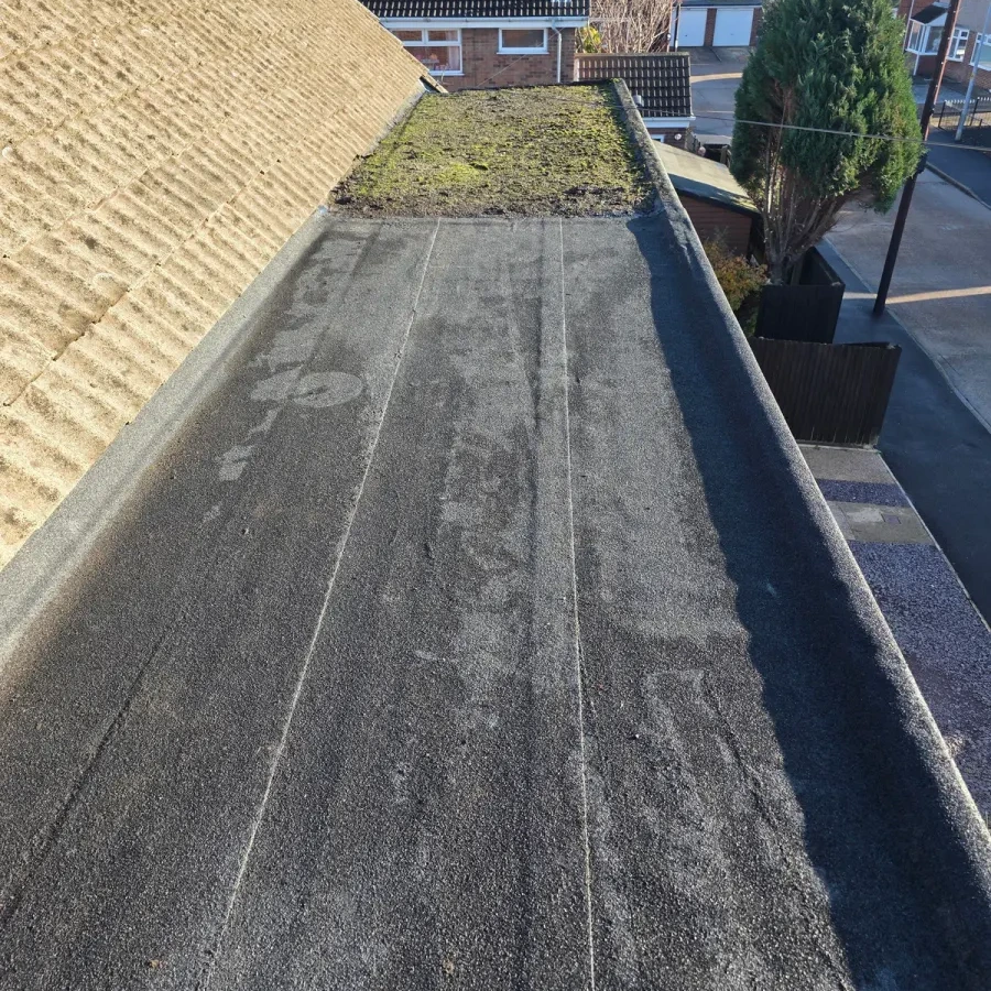 Long flat roof strip beside an external wall