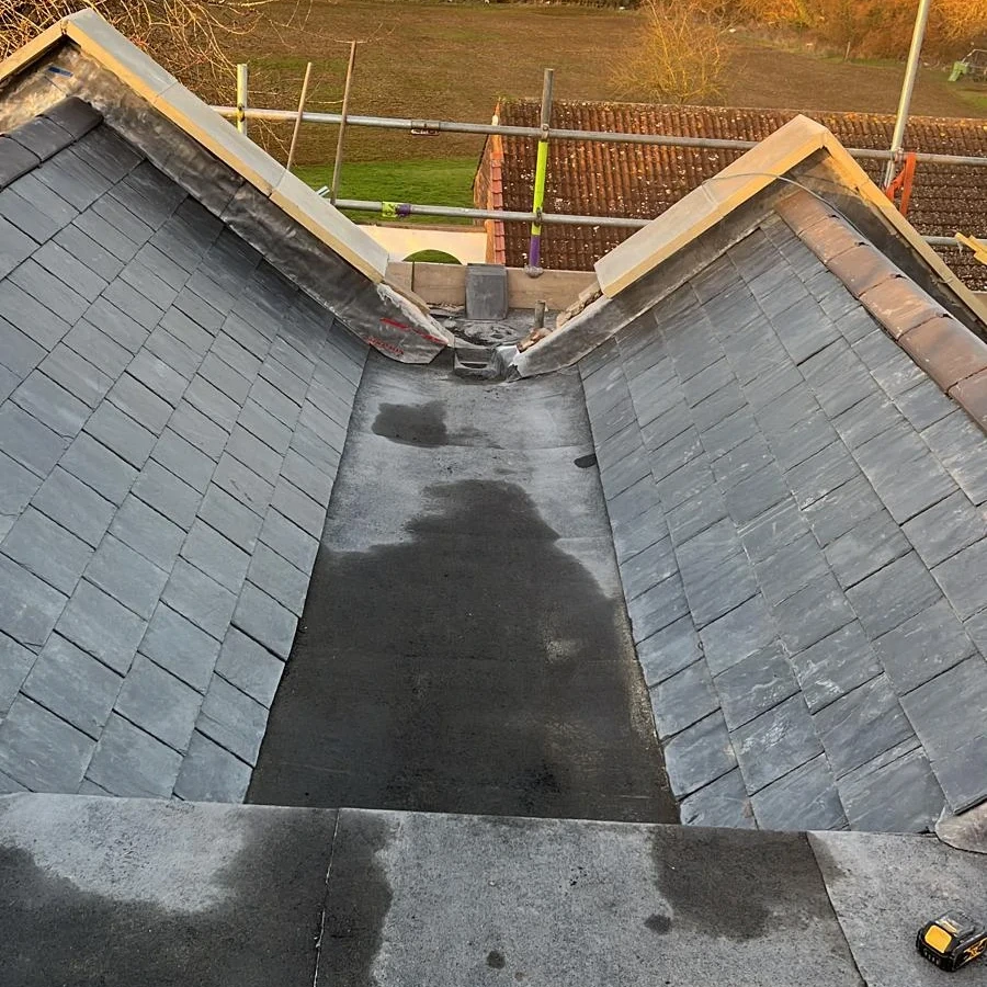 Roof valley work area with scaffold access