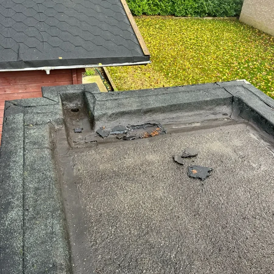 Existing flat roof surface and raised edge detail