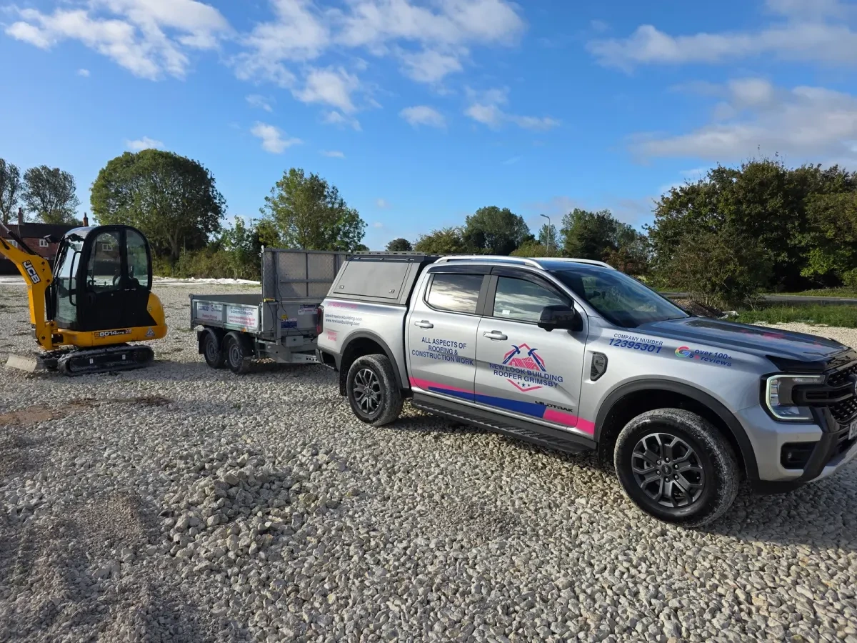New Look vehicle, trailer and excavator on prepared ground