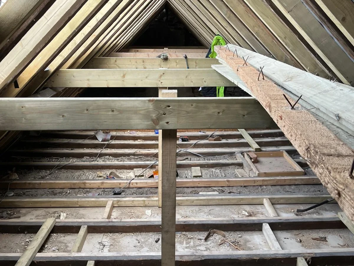View along the roof space and its central support timber