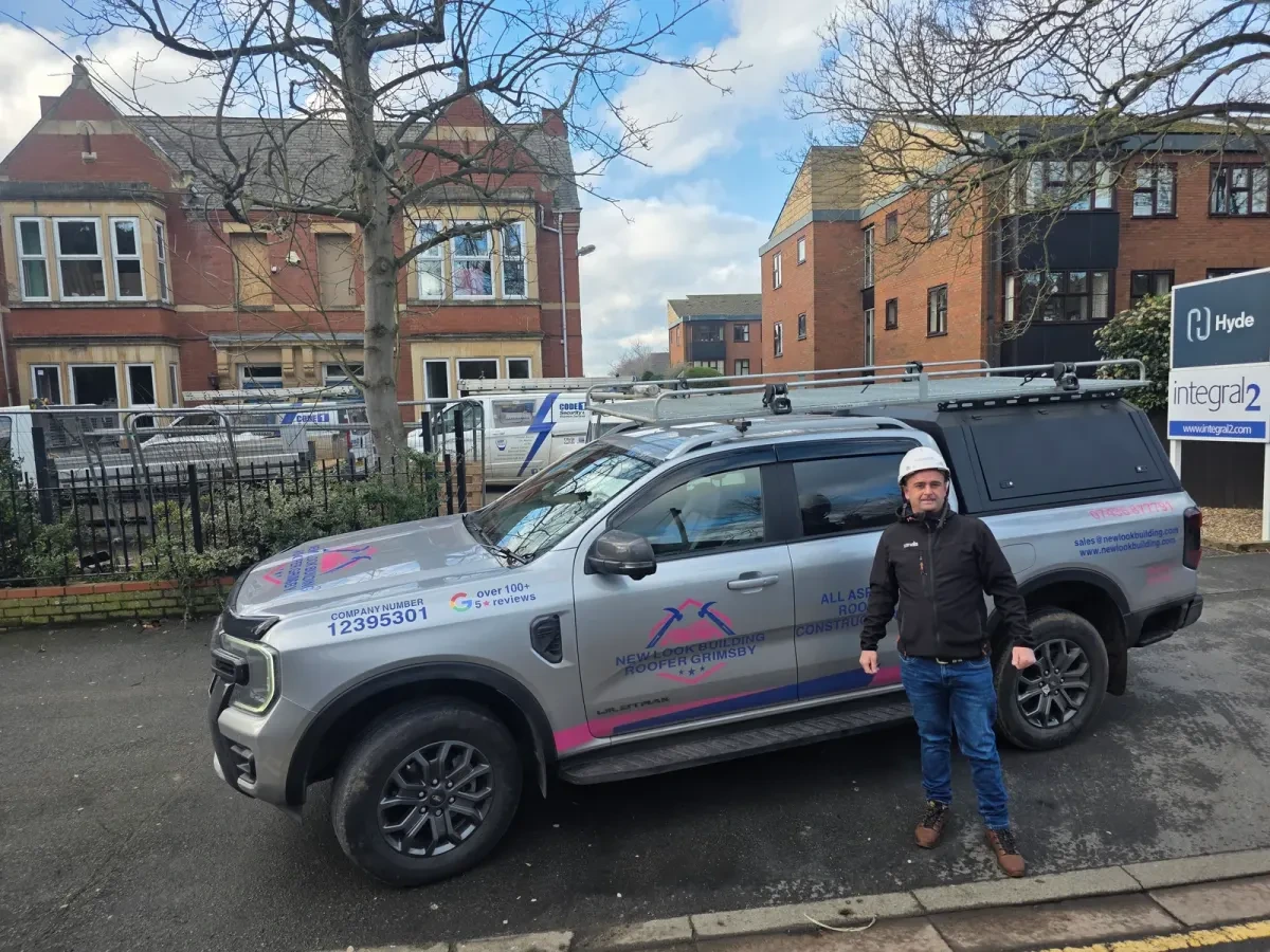 Person beside the branded New Look work vehicle